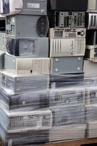 Photo of scrap computers with circuit boards containing gold, platinum and other precious metals that can be recycled by Specialty Metals.