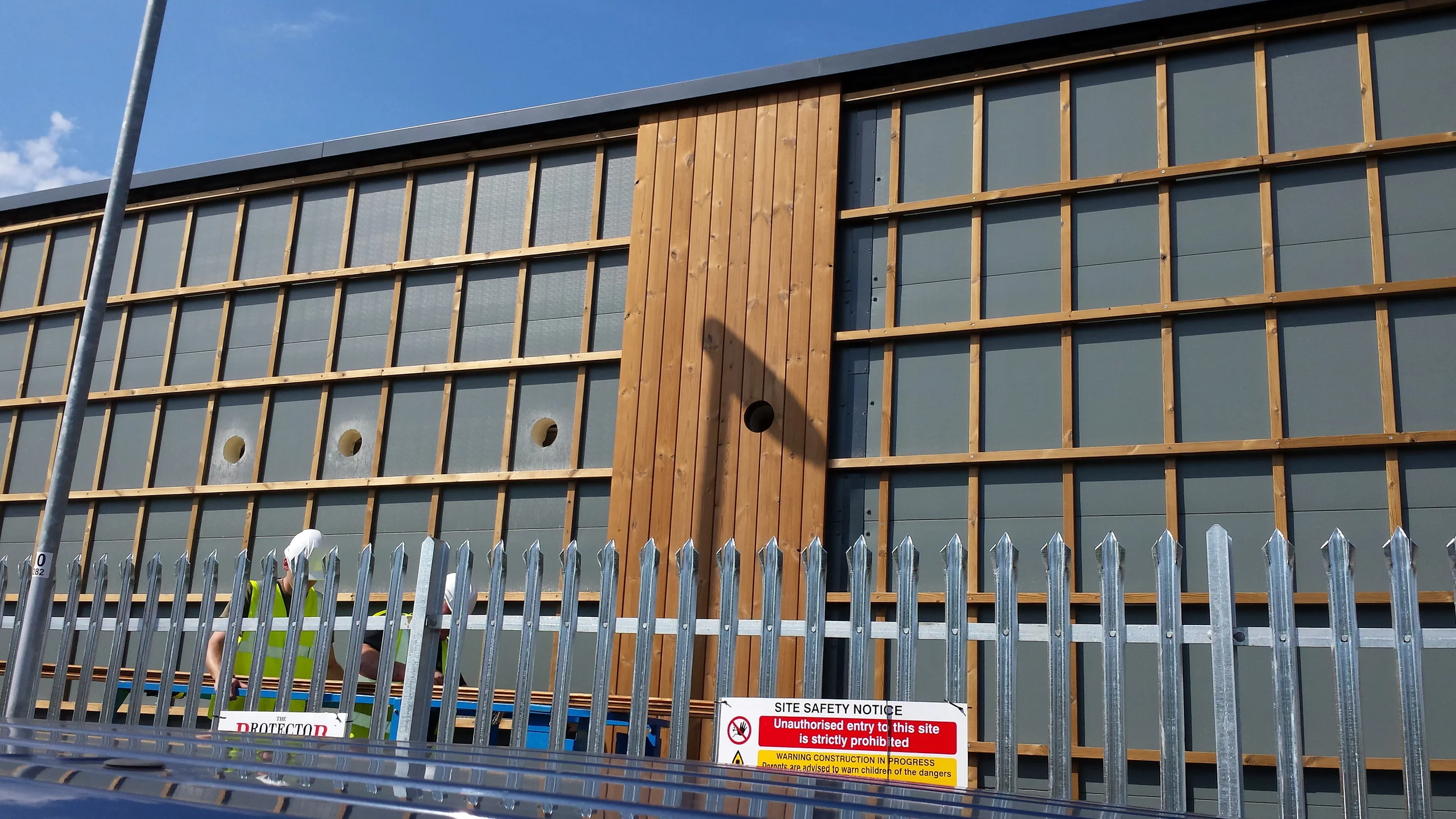 The specialist sub-contractors start fitting the Thermowood Cladding to the timber batons.