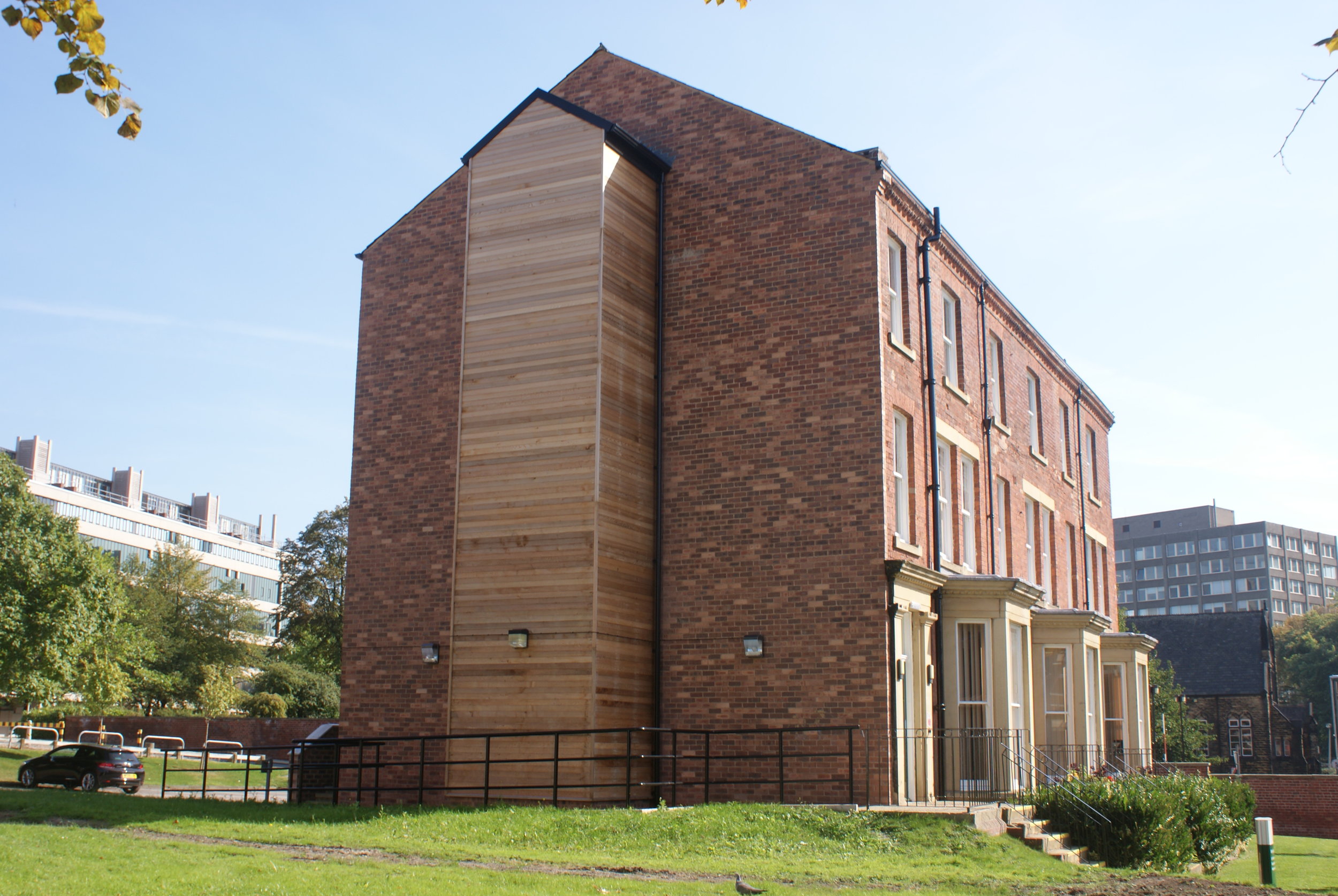  The new lift shaft was clad in cedar wood boarding to provide a contrast to the brickwork structure. 