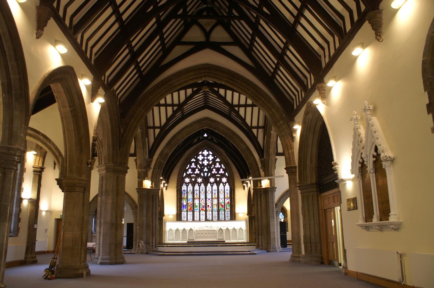  The concealed underground sunken baptismal chamber is located at the front of the church, below the stained glass window. 