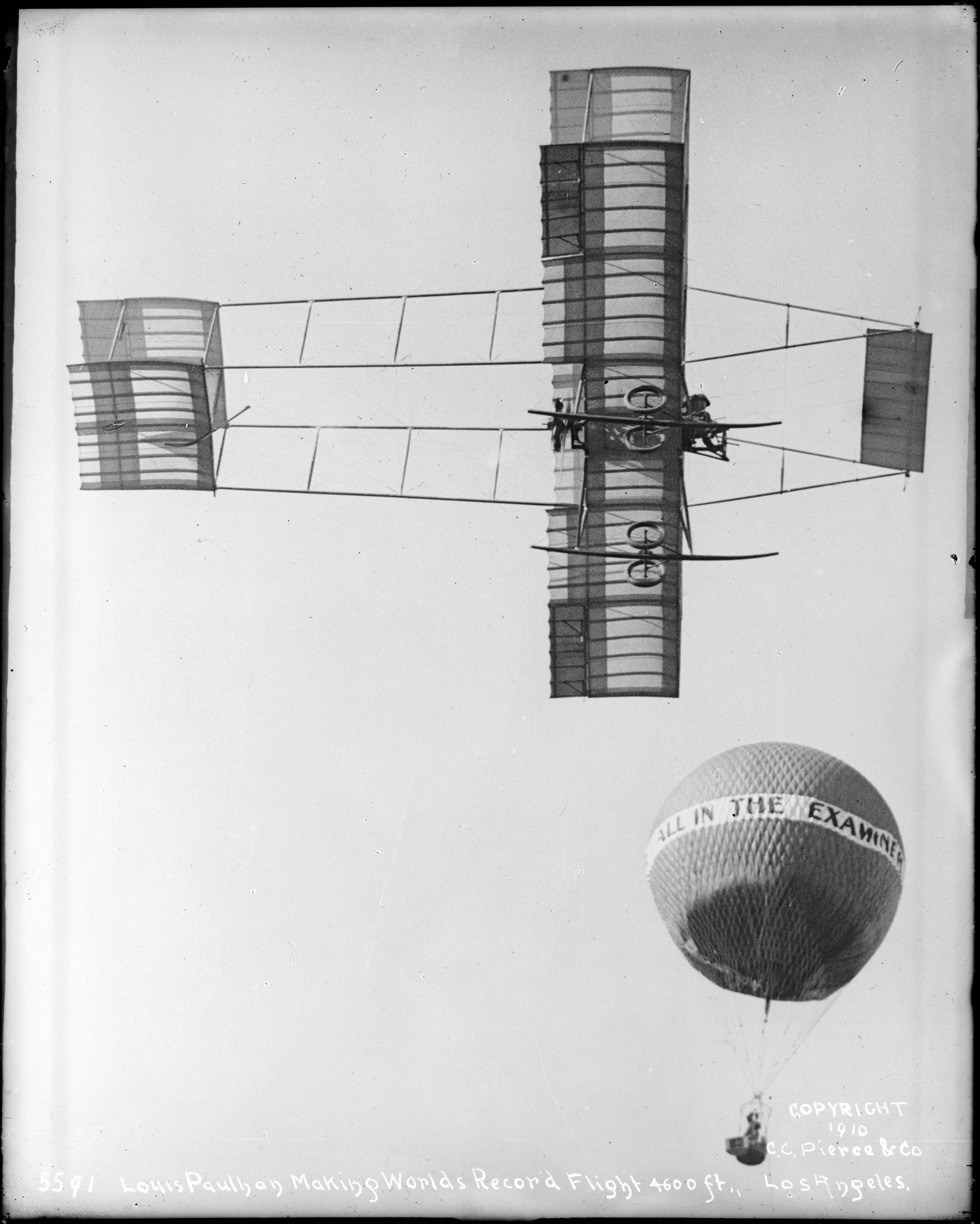  Louis Paulhan flying near a hot-air balloon in his Henry Farman biplane. &nbsp;(USC Special Collection) 