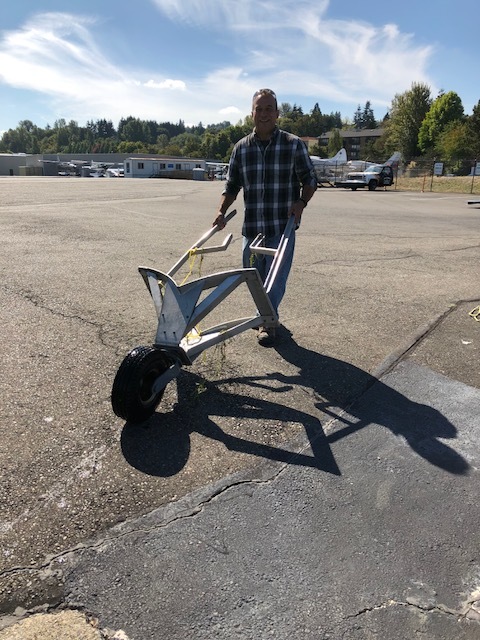  Laureano wheeled the beaching gear off the ramp as Bob and Mitch got them removed from the floats.  