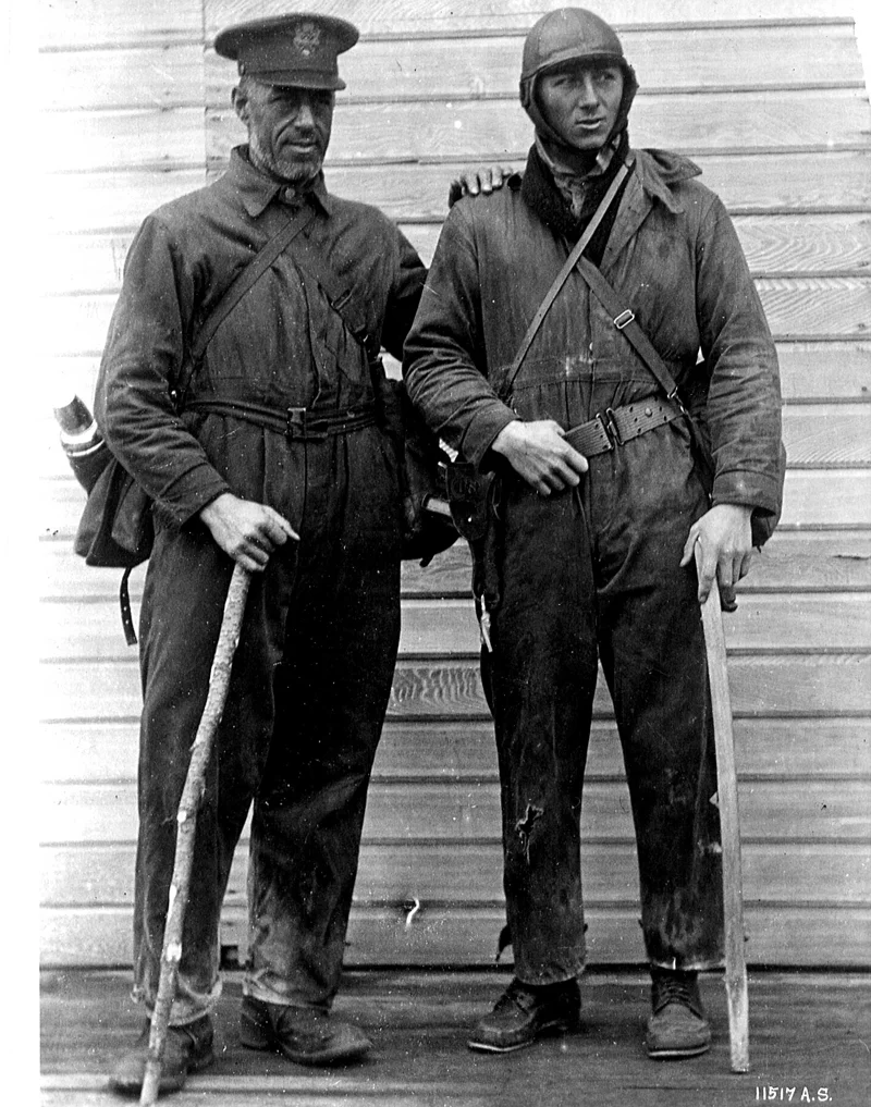 The original caption reads: Major F. L. Martin and Sgt. Harvey, taken on return to civilization after being lost in Alaska for 10 days when plane crashed into the side of a mountain. (342-FH-3B-7971-11517AS)