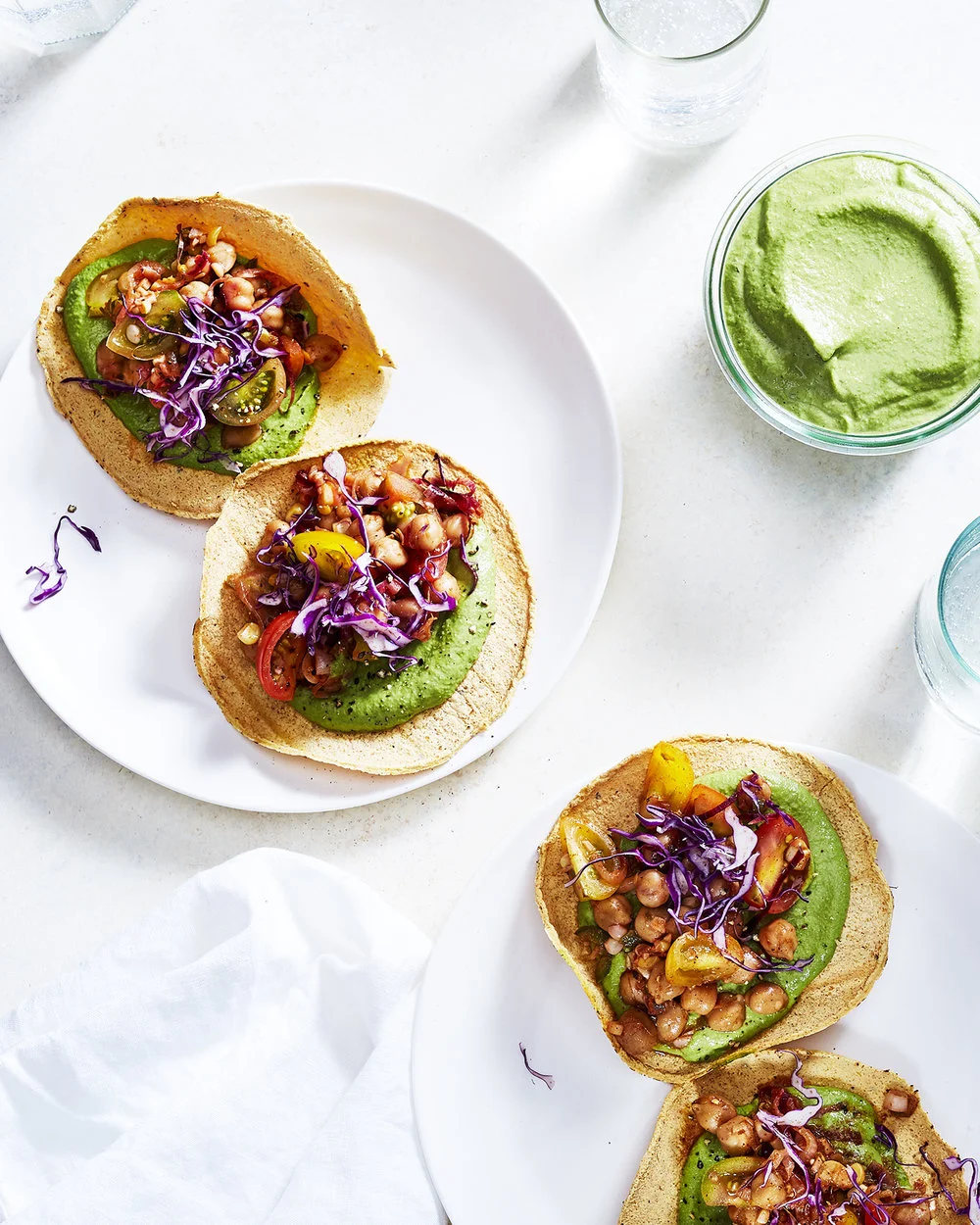 CHICKPEA, SWEET CORN & CHERRY TOMATO TOSTADAS WITH AVOCADO CILANTRO PESTO