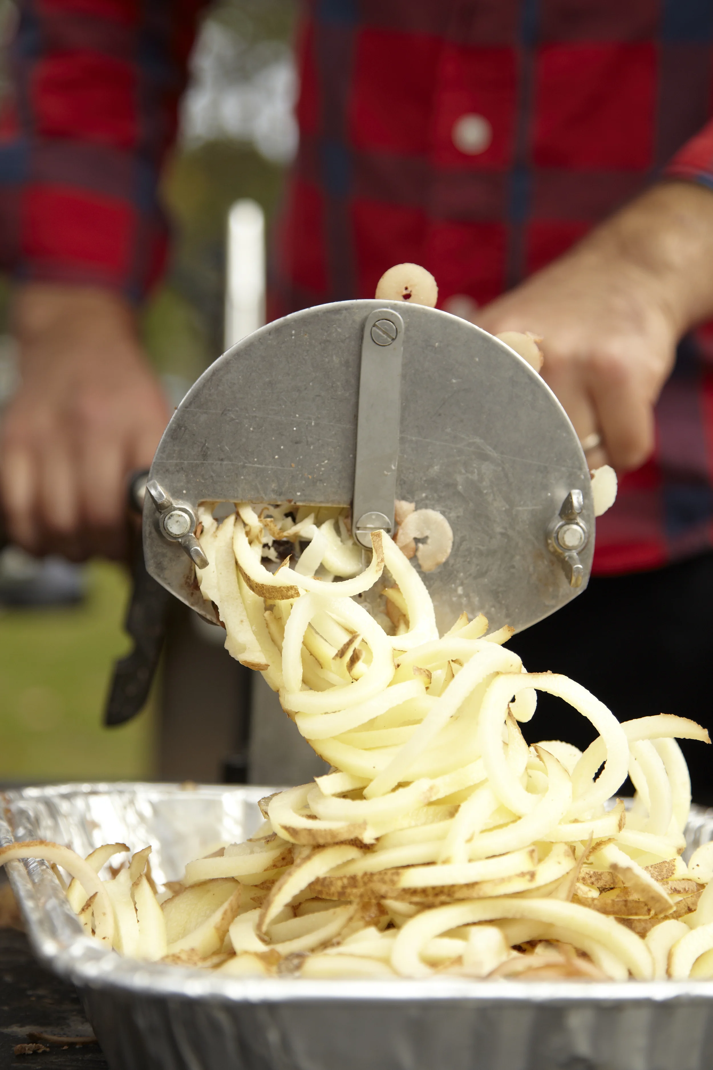 Reuben Schwartz makes spiral cut fries at the Spa City farmers market for Vital Eats in Saratoga Springs, NY.