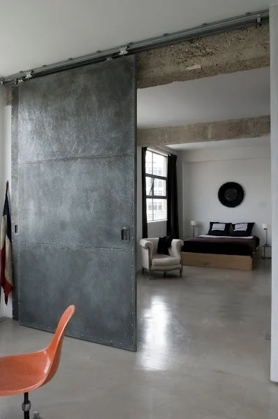 -via misterthree.com (definitely not for most homes, but it works with the polished concrete floors and the exposed beams in this large space)