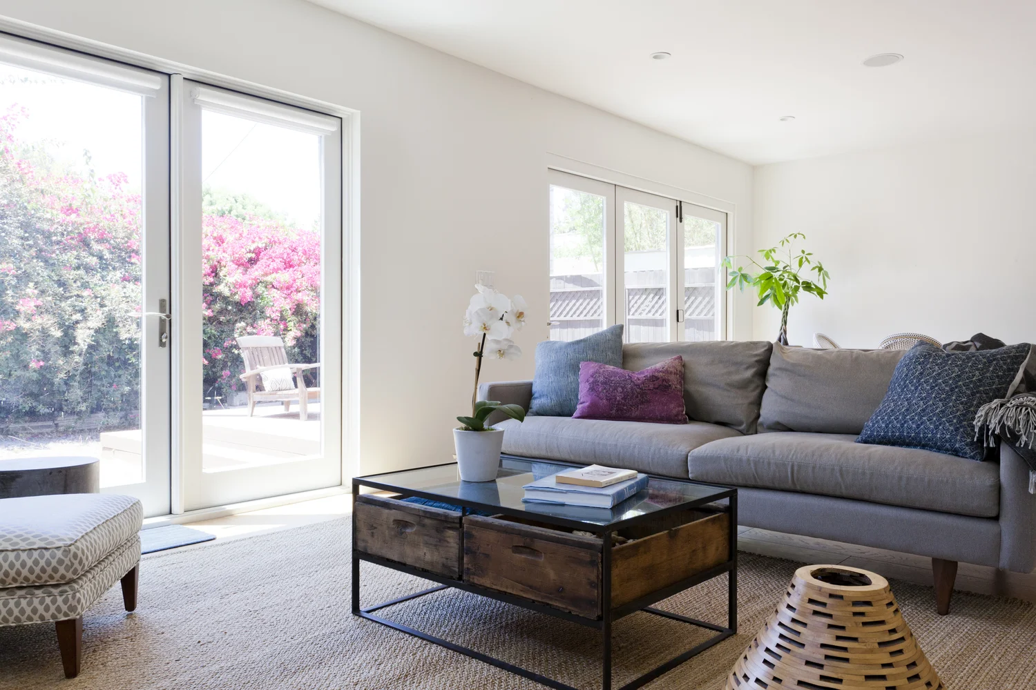 AFTER - This family room is where the family spends most of their time. It's super comfortable and casual, with tons of natural light. - photo by Heather Culp