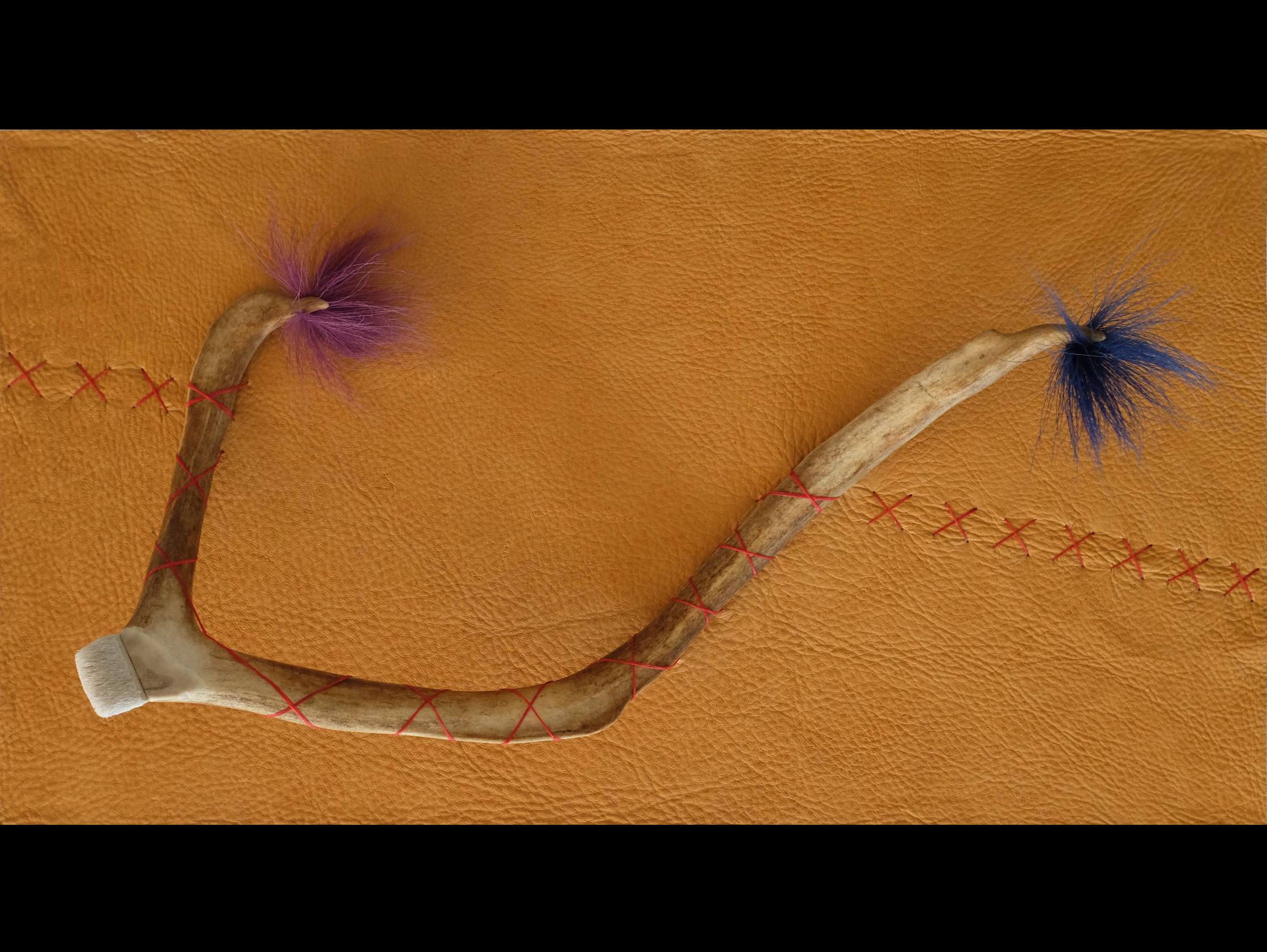   Traces, 2014, caribou antler, caribou hair, and sinew on elk hide,&nbsp;  11" x 20" x 5"  