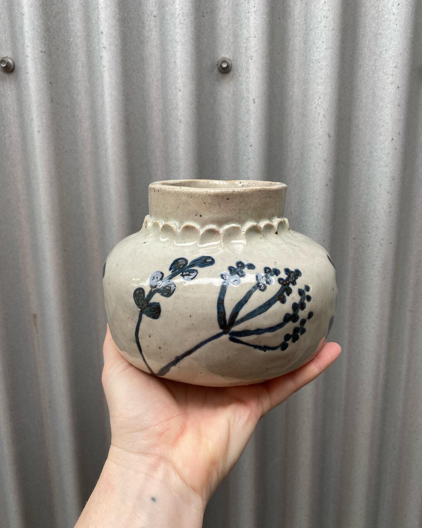 Really happy with how this coil-built vase turned out! It came out of the @pottersguildofbc community gas kiln today. Black underglaze painting under clear glaze.