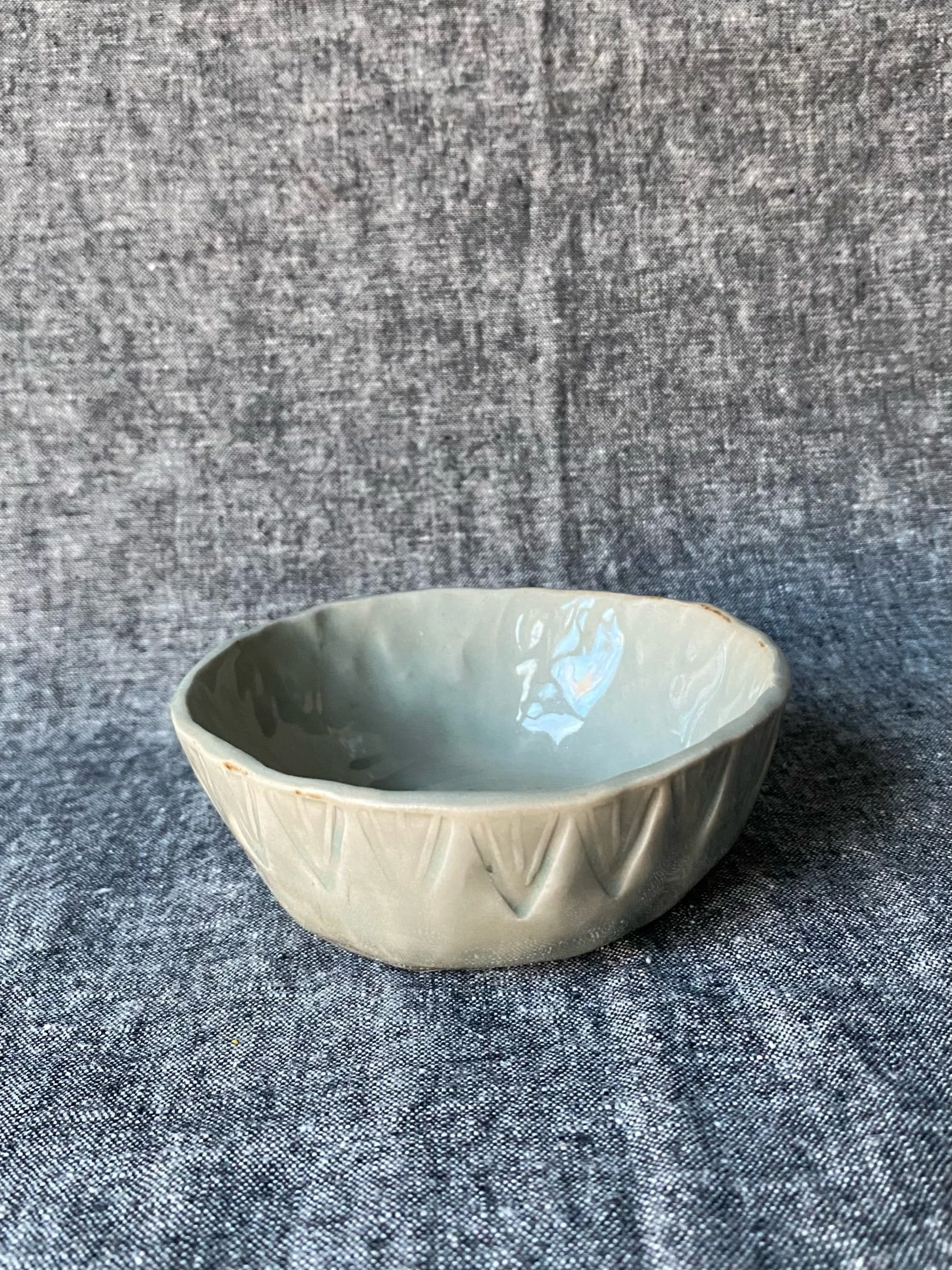 Stamped celadon bowl