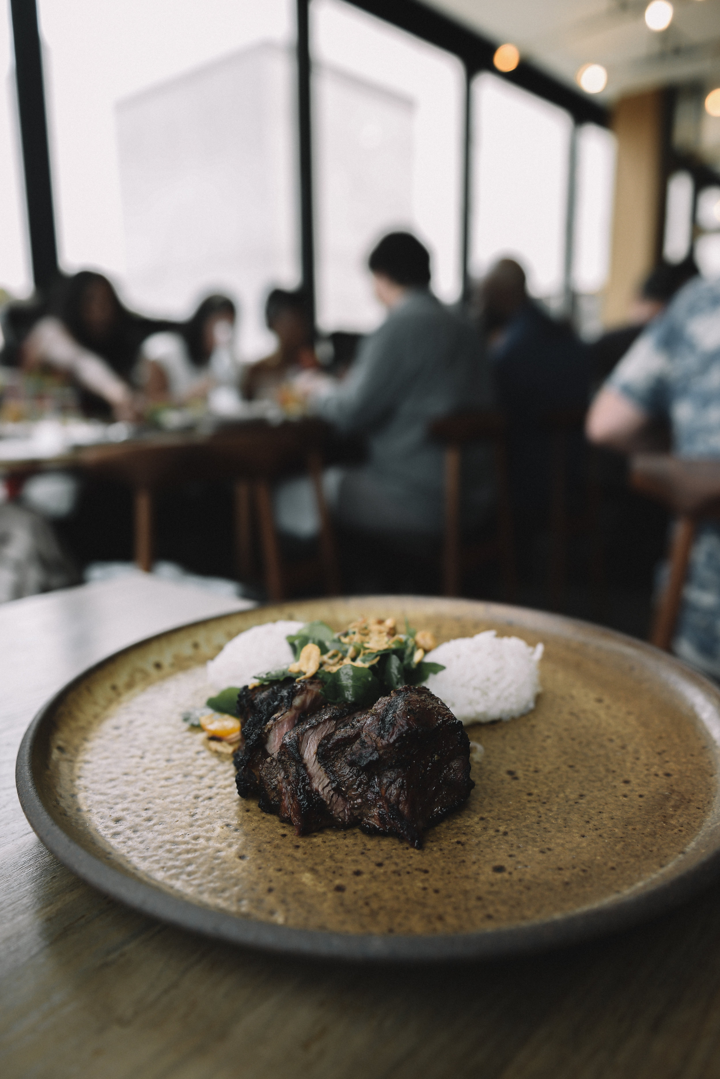 Grass Fed Ribeye โข Garlic Rice โข Arugula โข Shallot โข Tomato โขCilantro โข Peanut