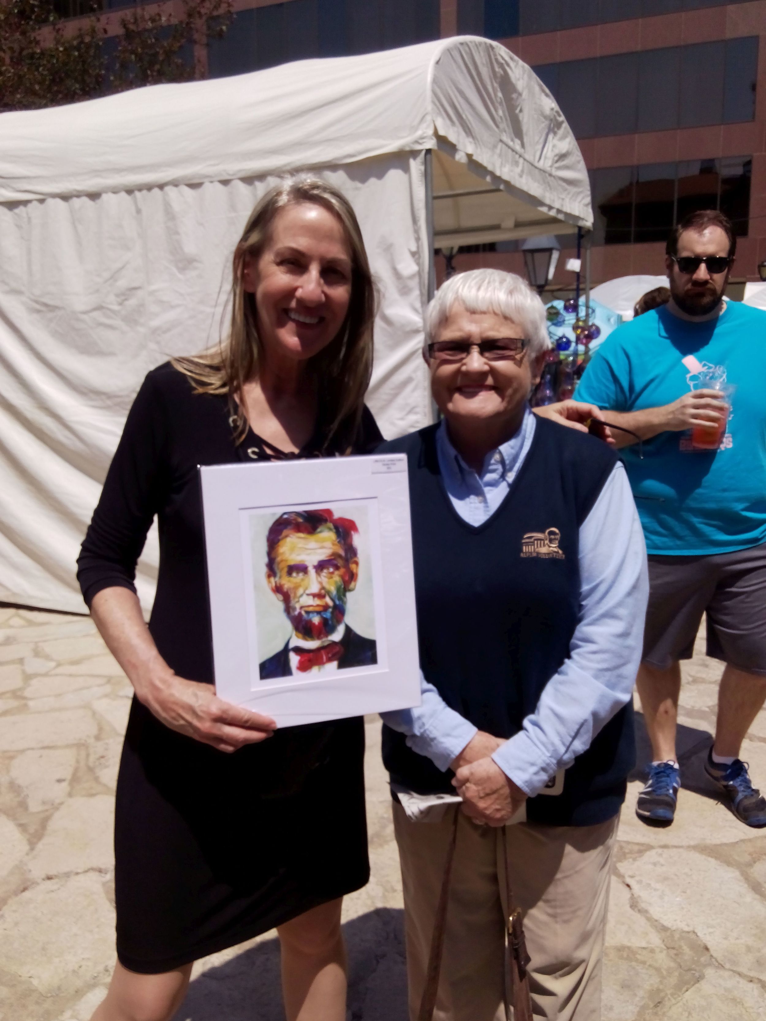 With a museum volunteer holding her "Lincoln" in Springfield, IL at the Old Capitol where Lincoln worked