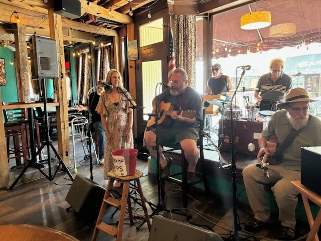 Preforming a bluegrass tune with my husband, Mark at The Grape Escape, Galena, IL.