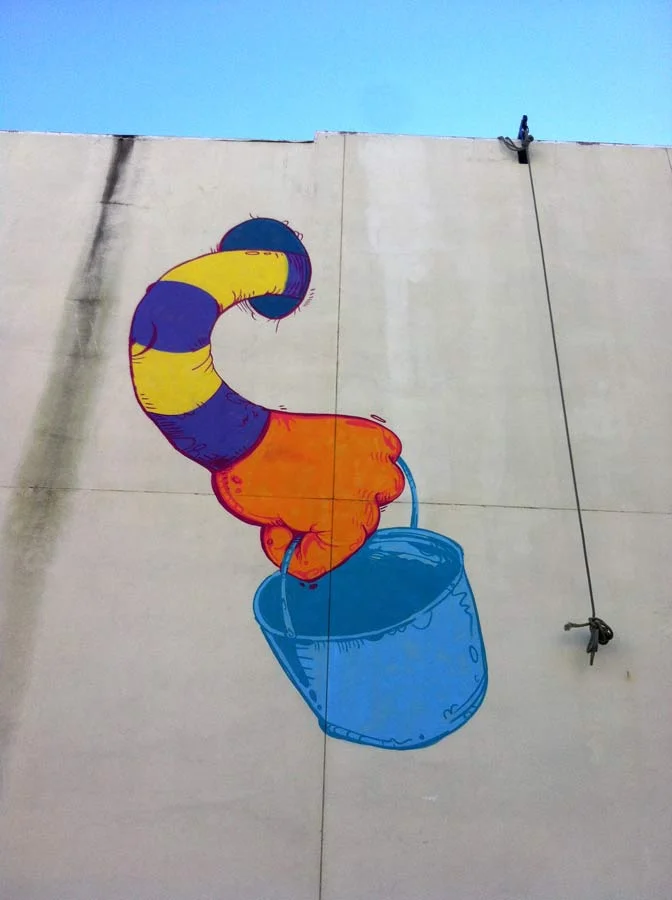 Mural in downtown Savannah, GA. Done from the rope seen hanging there. 