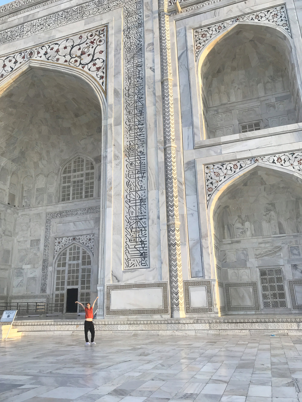 the huge white entrance of the Taj