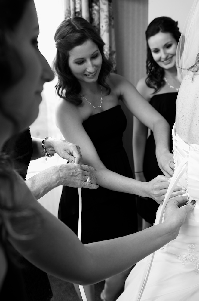 Mom gets the dress laced up.