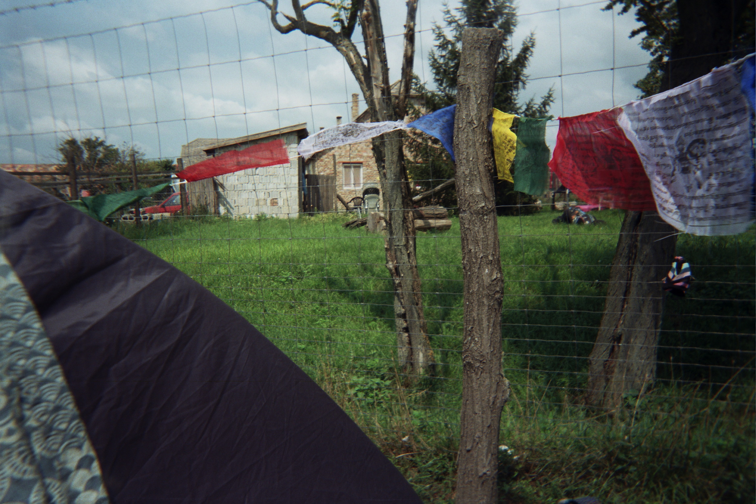 The prayer flags spell to us a blessing beyond the fences. The Buddhist chants that ring beyond the senses. 