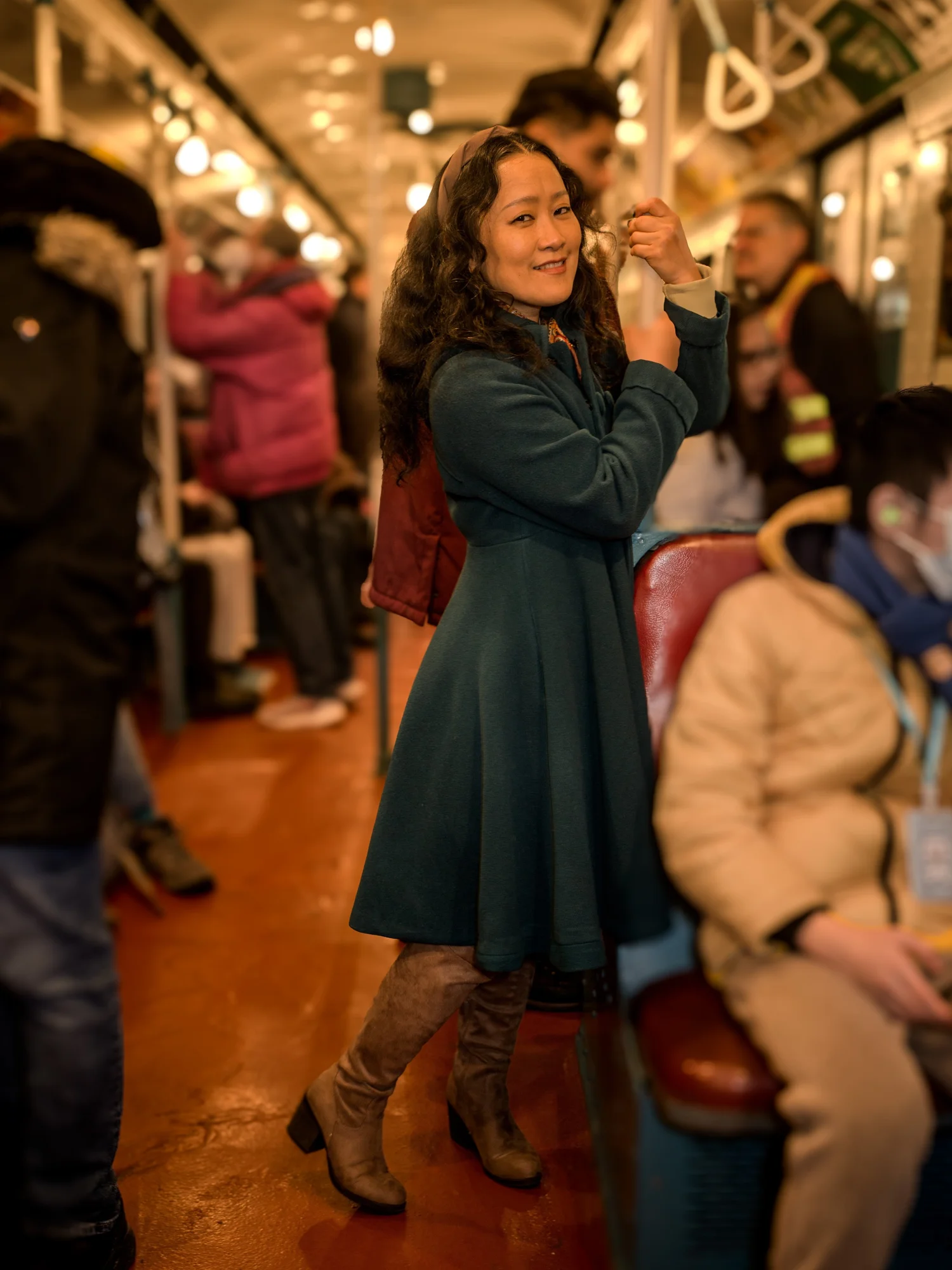Woman in a green vintage dress in a crowded vintage subway car