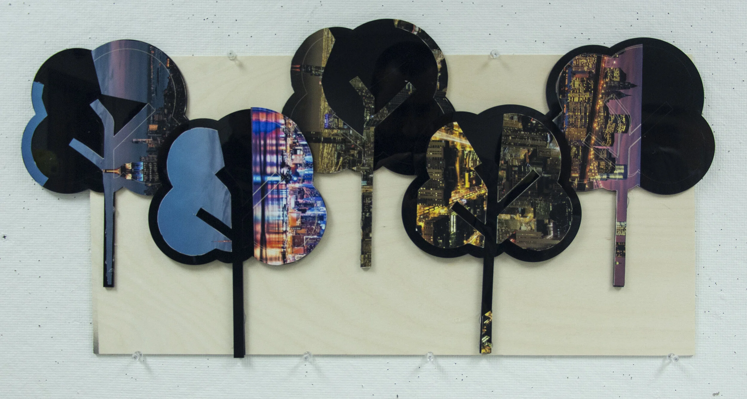 Sami King - "CO​2 ​Trees"; Laser cut/engraved acrylic and digital prints on paper, wood