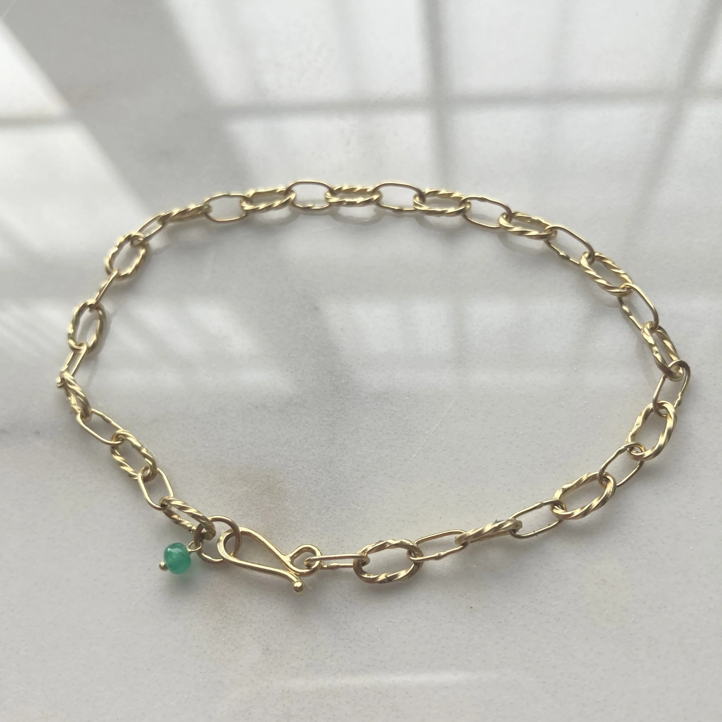 BabyBowlineEmeraldBraceletOnMarble_square.jpg