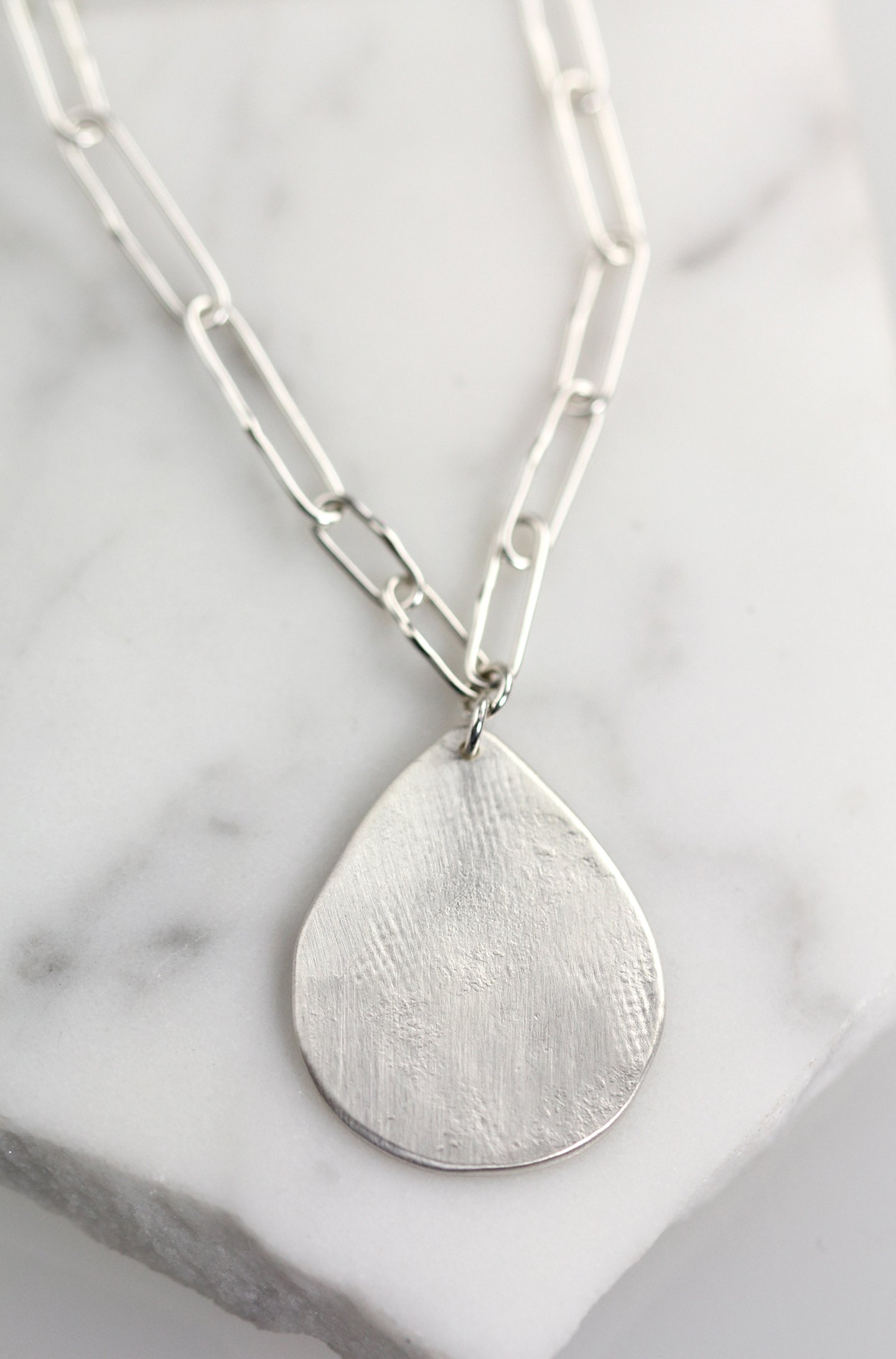TannerNecklaceOnMarble2web.jpg