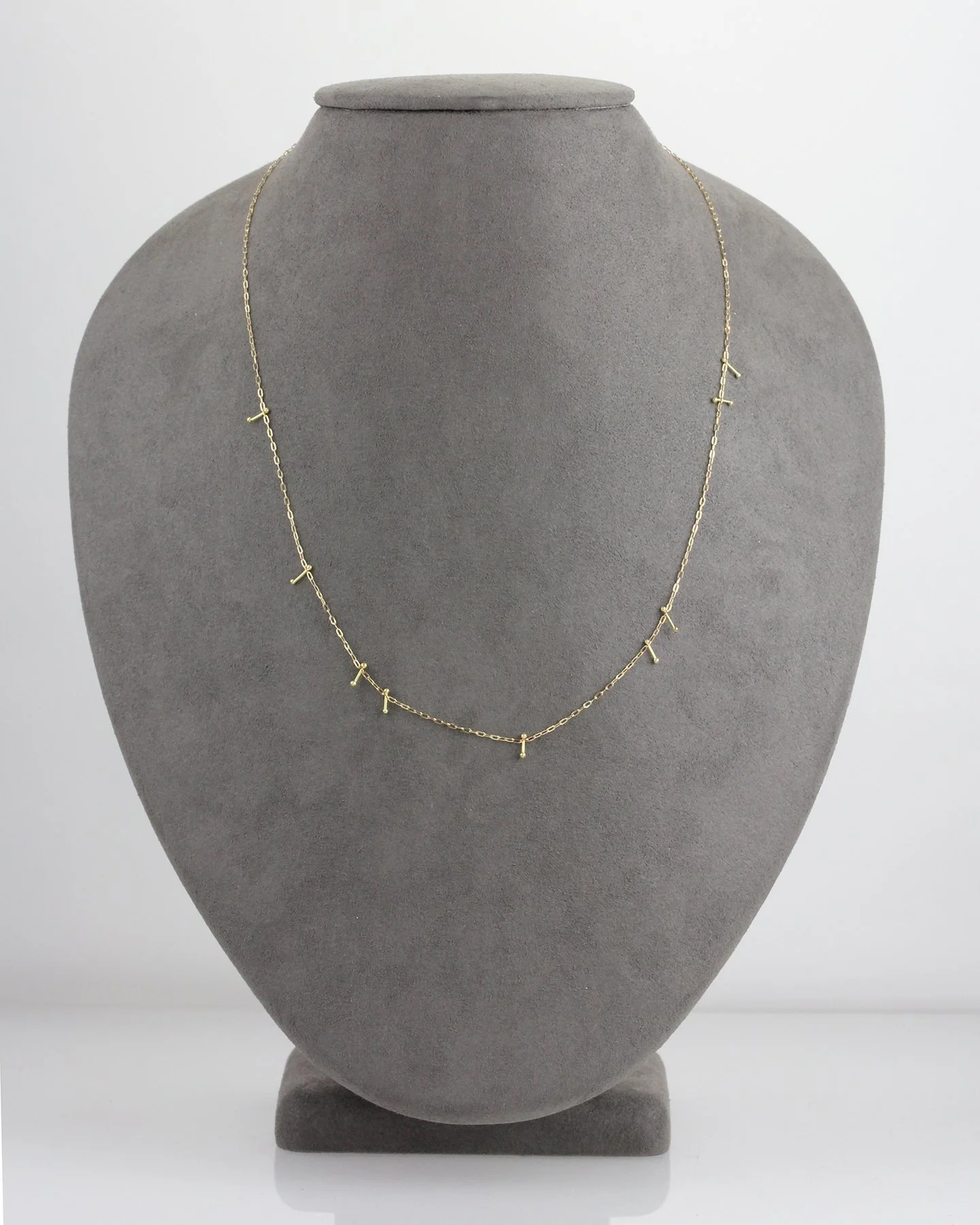 GreyNeck_PinnedNecklaceGold.jpg