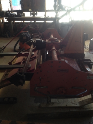  Removing the rear gate in order to gain access to the tines underneath.