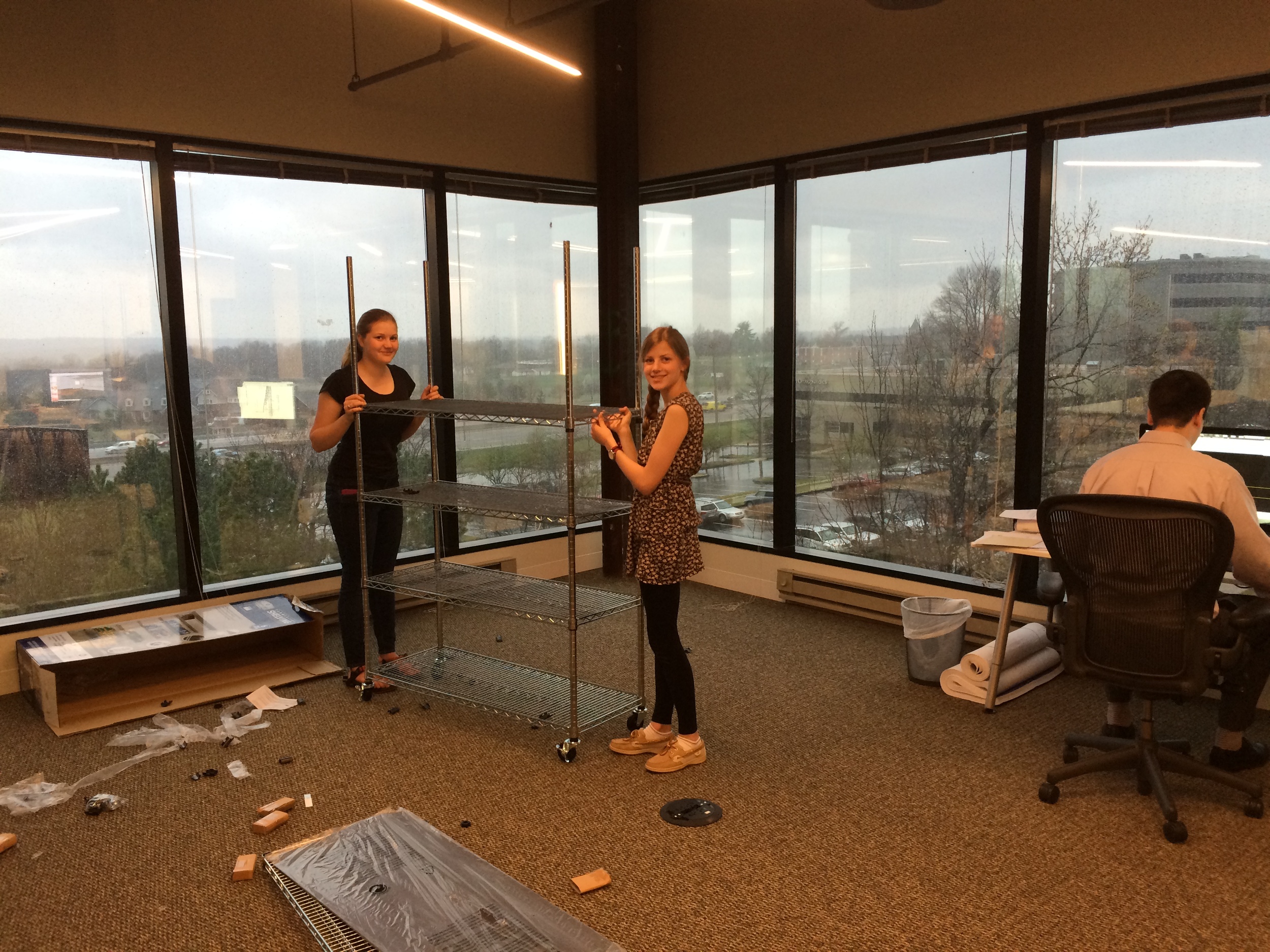 Brian's daughters helping with shelf assembly. They did a great job! Note how much help Adam offered them.