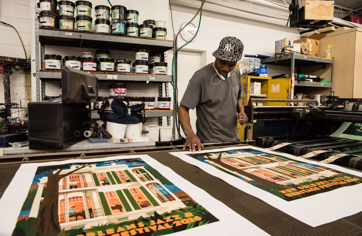 Joe Edwards checks the ink at DMR Graphics in West Conshohocken. DMR's posters for the New Orleans Jazz & Heritage Festival have become collector's items.
