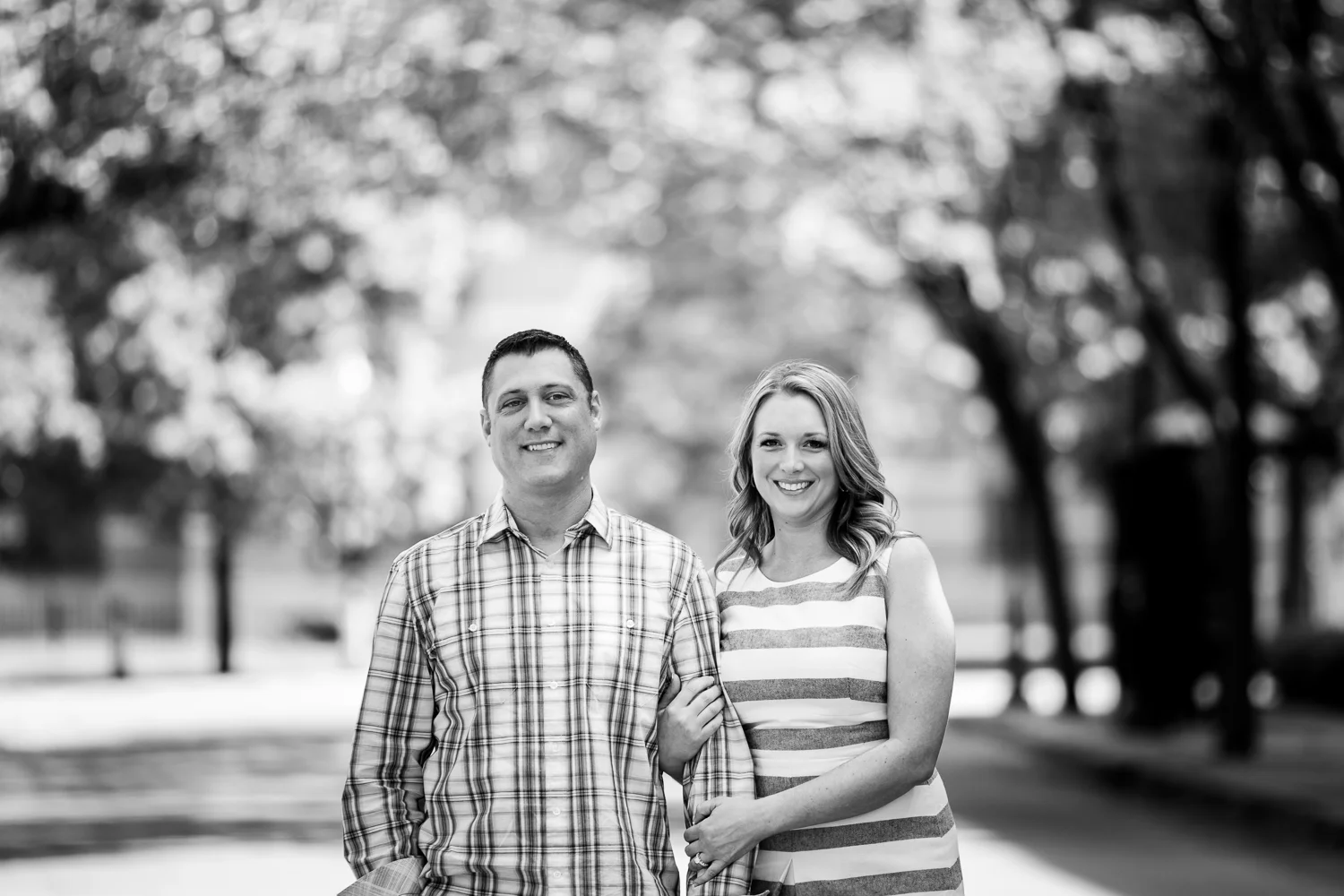 black and white engagement session bride and groom hugging