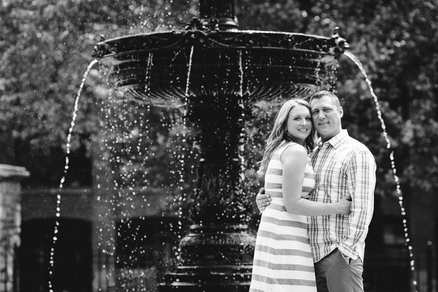 bride and groom in front of Franklin Square fountain