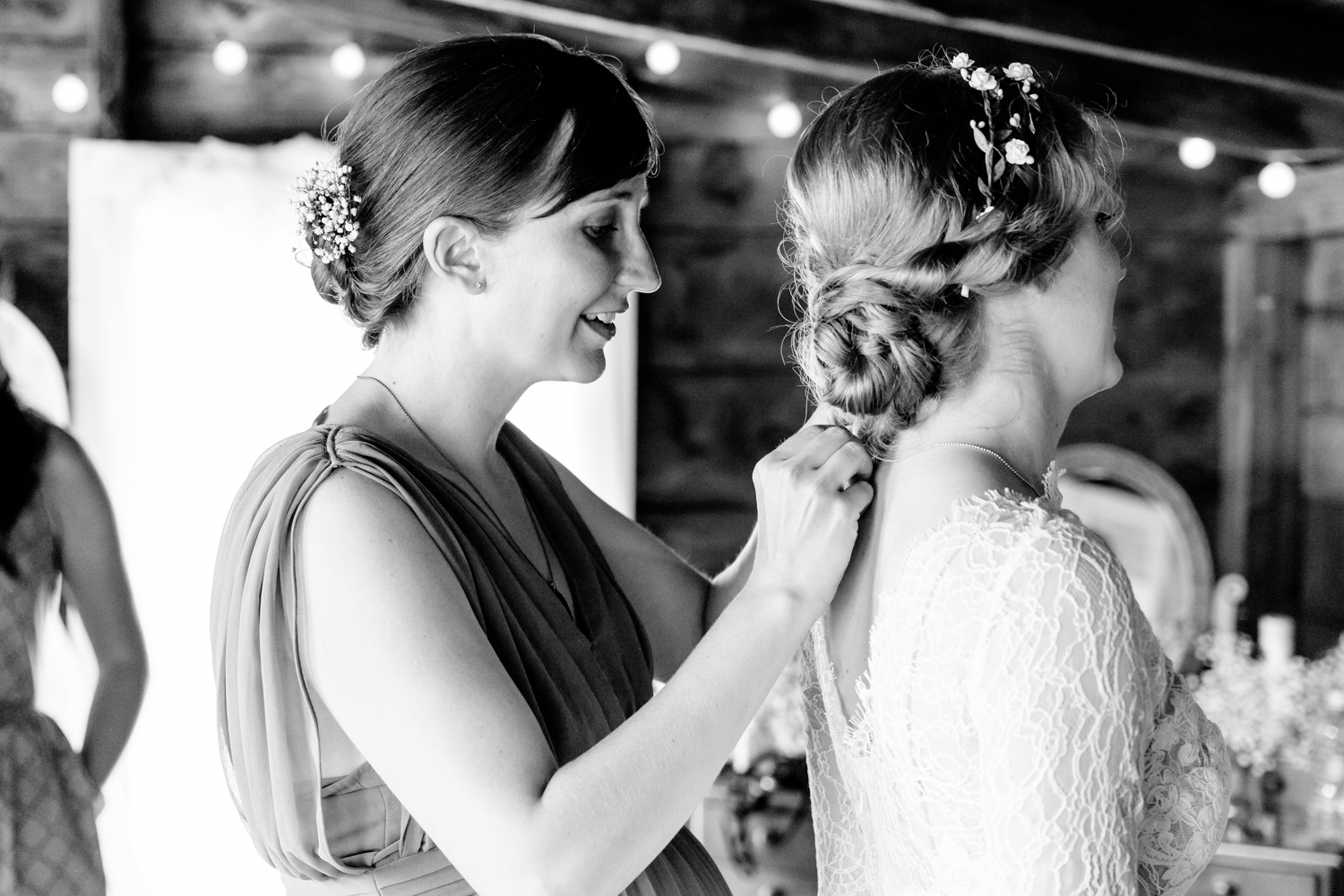  A sister helps the bride get ready. 