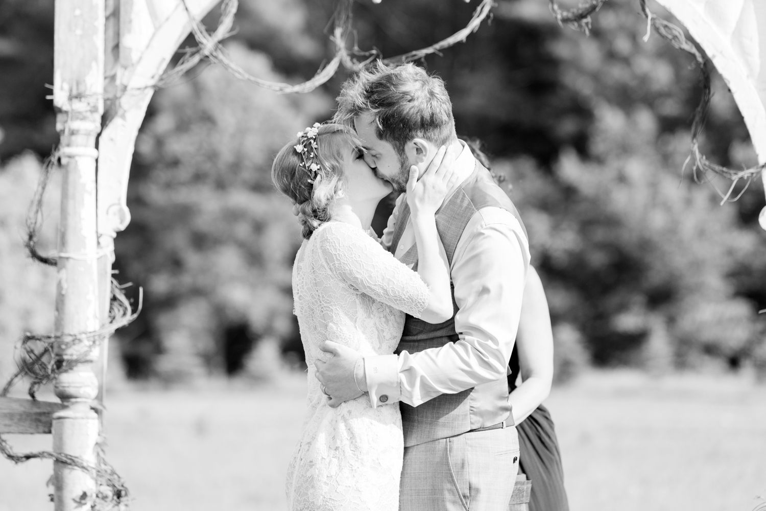  bride and groom share a first kiss 