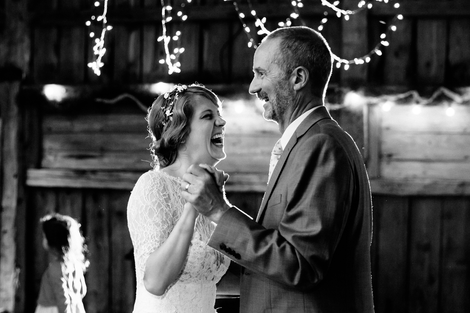 Bride and father share a dance in a barn 