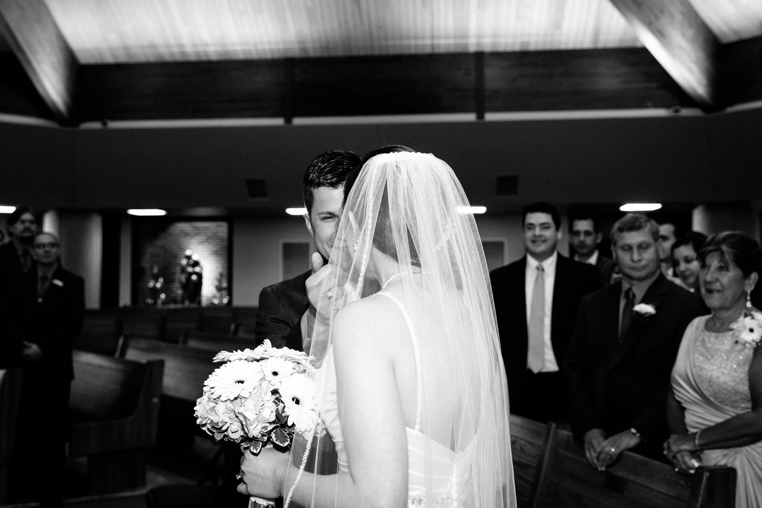  A touching bride and groom moment at Holy Family Church in Syracuse, NY. 