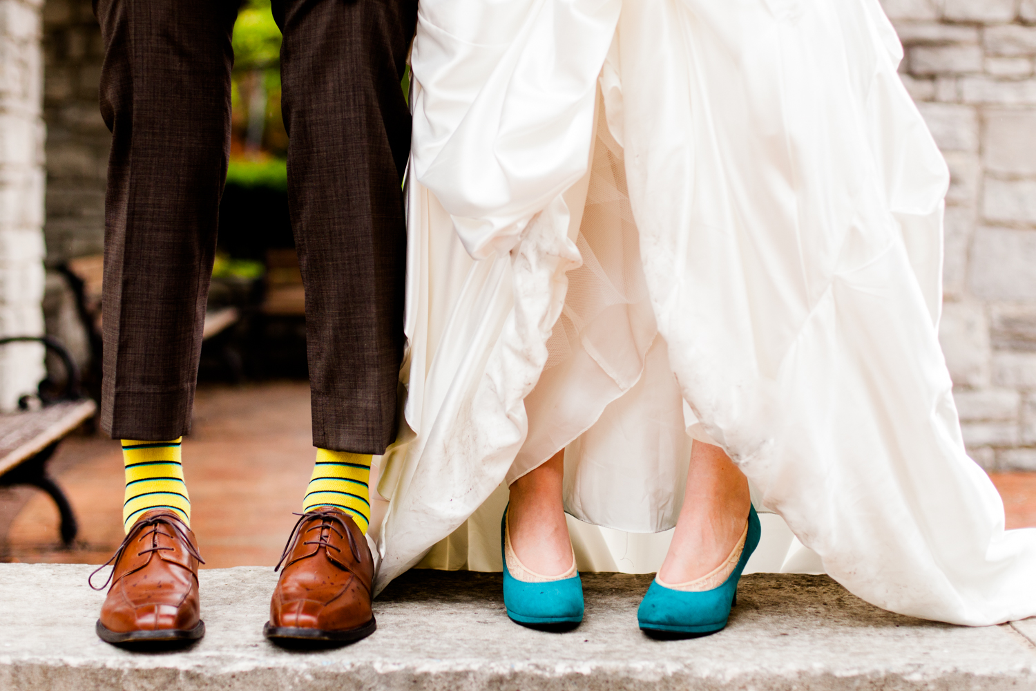  Bride and groom show off wedding shoes 