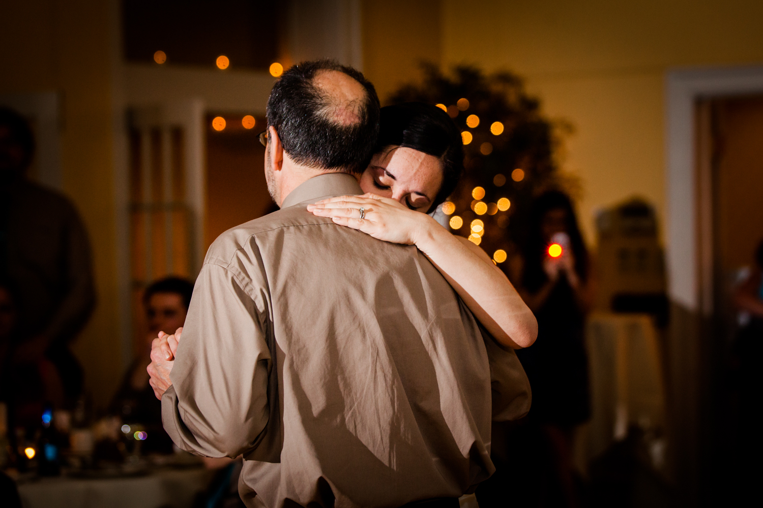  Father and daughter hug during their dance 