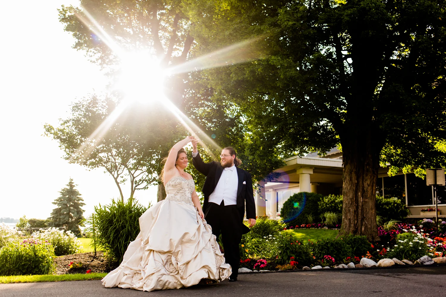 Groom twirls bride at Lakeshore Yacht and Country Club.