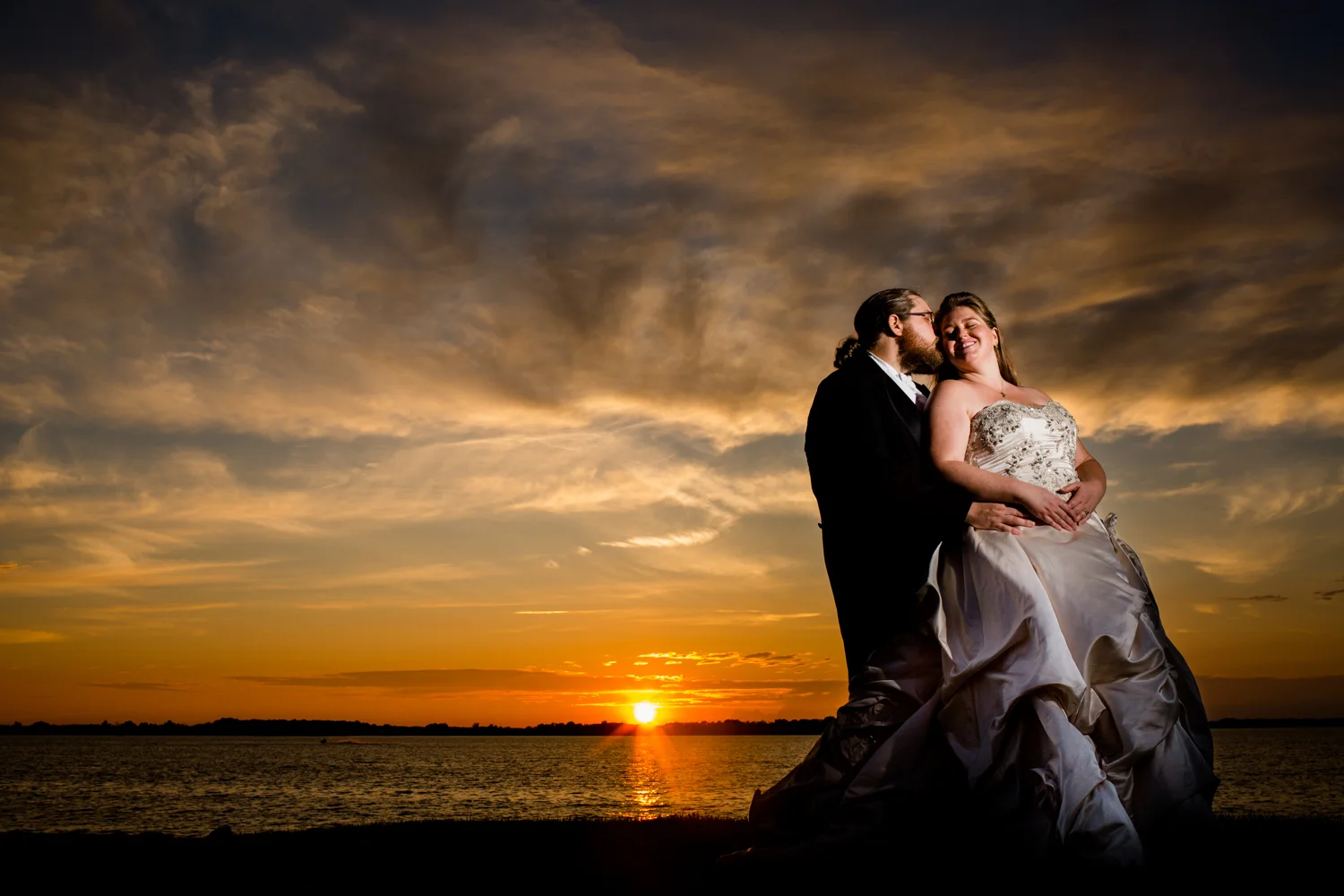 Bride and groom sunset image.