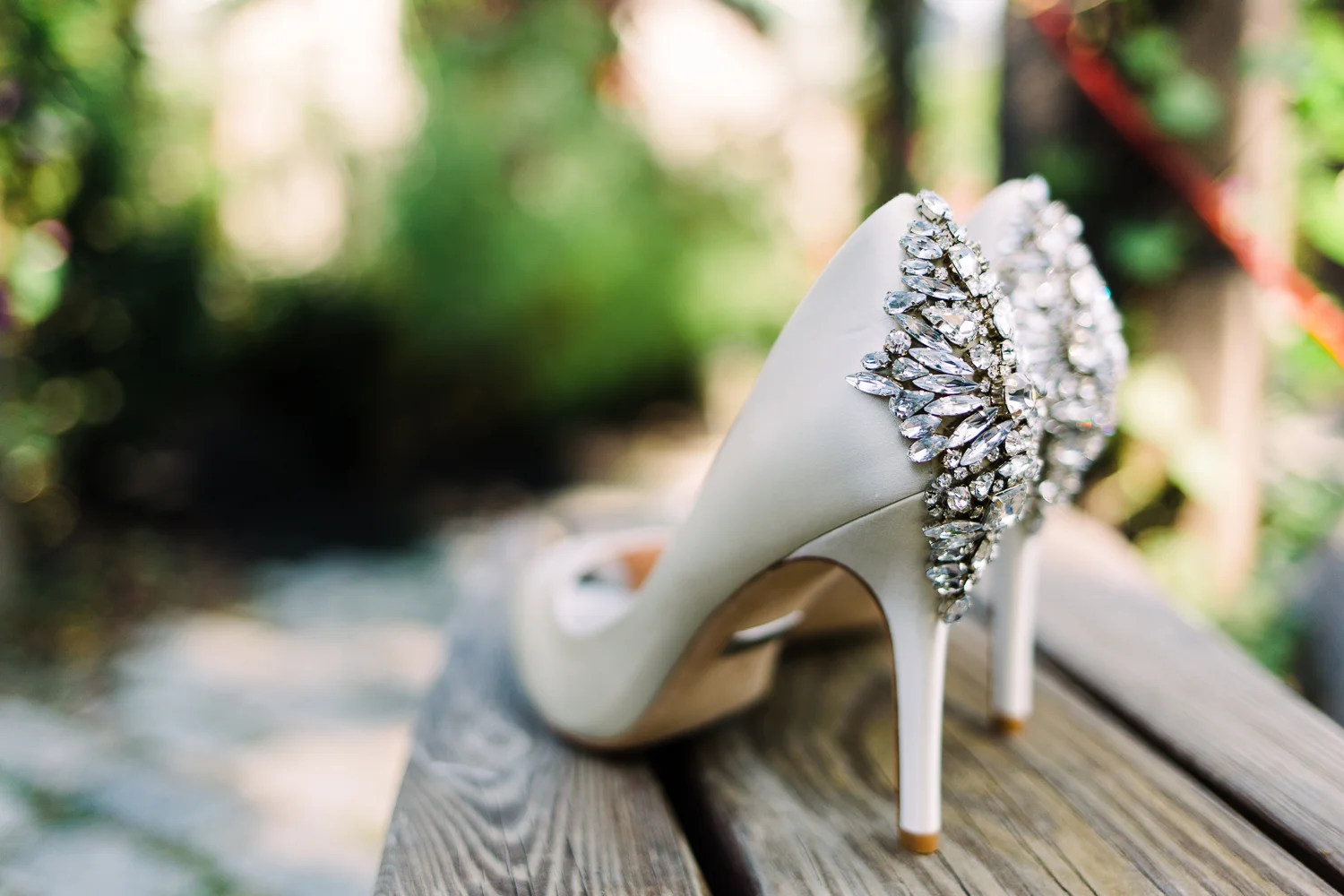 White wedding heels with diamonds on the heels.