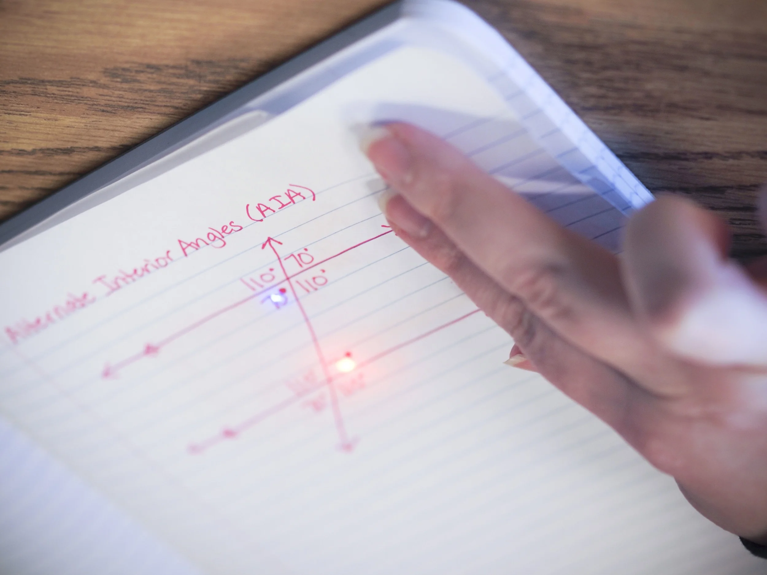 Calling out congruent angles when two parallel lines are transversed by a straight line
