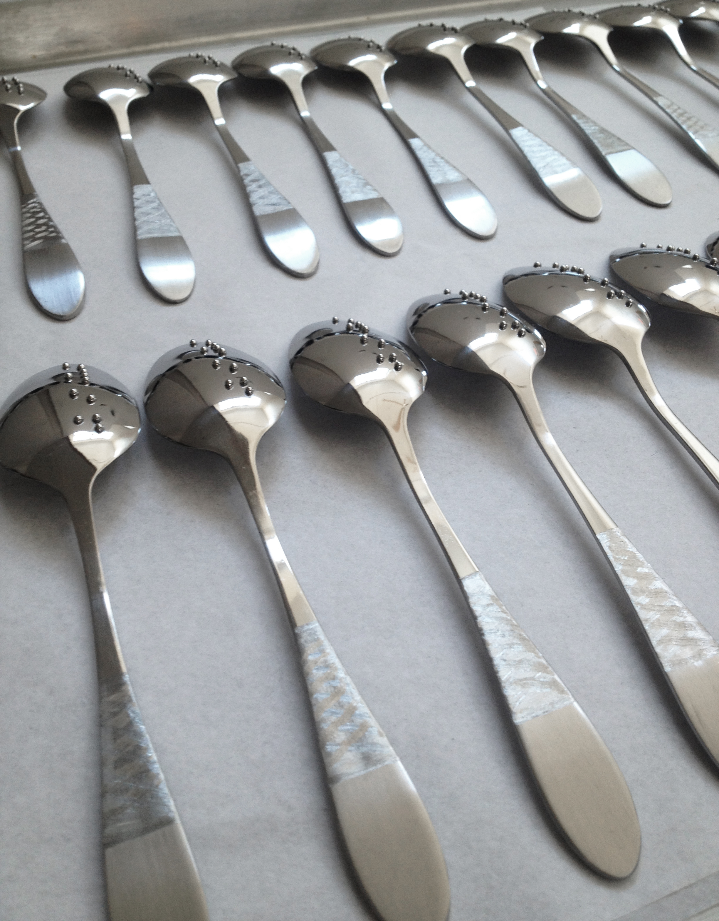   Lip reading   Braille Spoons  Ongoing since 2007.  This set produced for  The Paseo pop-up Dinner in the Dark (2014) . 
