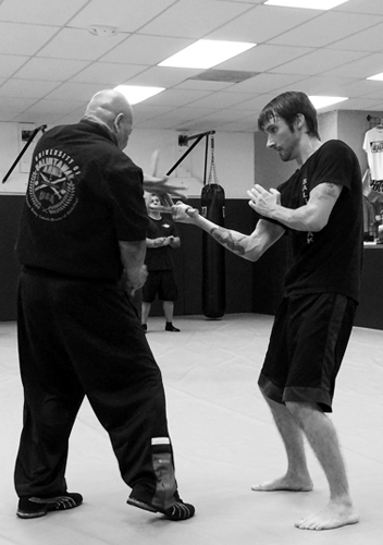 Grandmaster feeding Nathan during his Level 3 test.