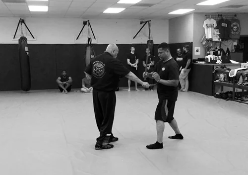 Grandmaster feeding Prof. Penn during his Level 5 test.