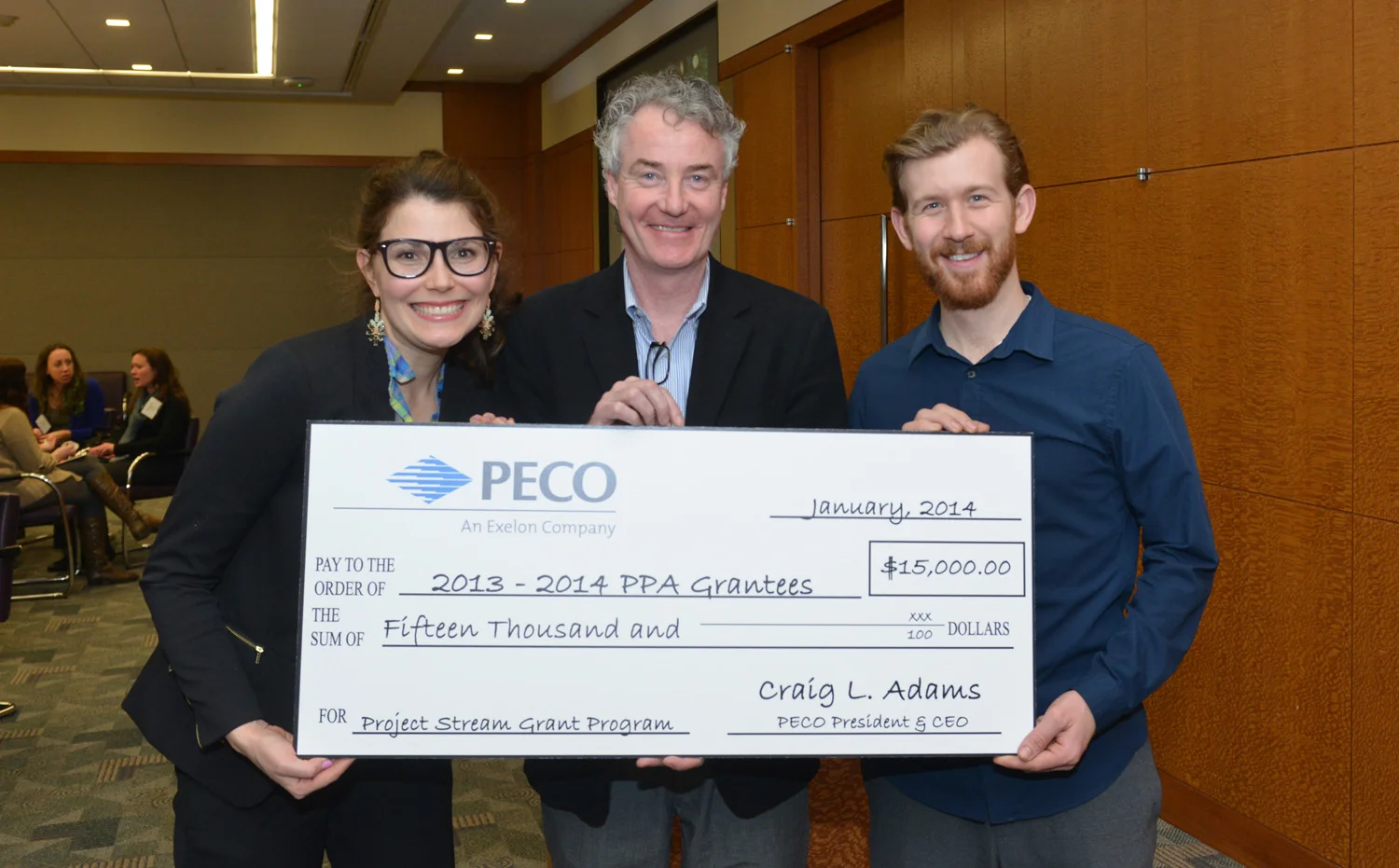 Education Director Jess DalCanton and Artistic Director Griffin Stanton-Ameisen pose with John McInerney, Vice President of Marketing & Communications of The Philadelphia Cultural Alliance at the 2014 PA Partners in the Arts Project Stream Check Ceremony.