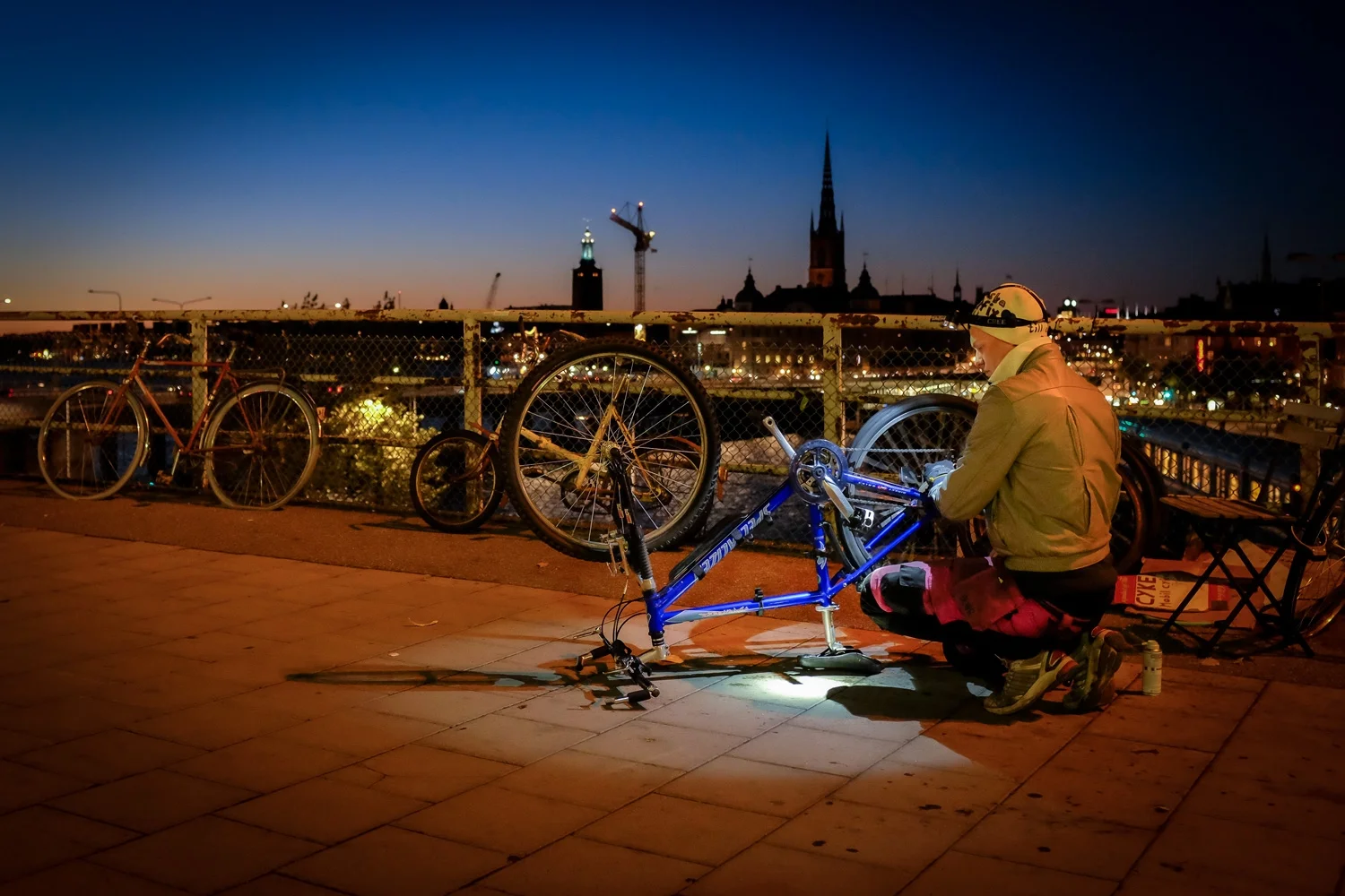 Impromtu bike repair. Slussen, Stockholm, Sweden.