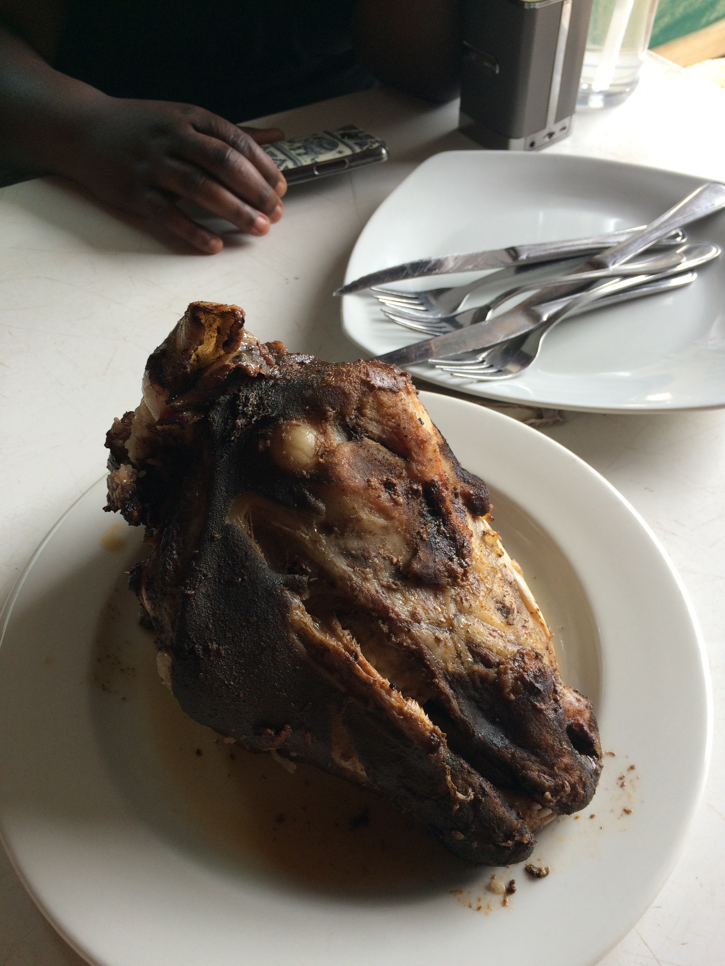 Grilled sheep head called “Smiley”