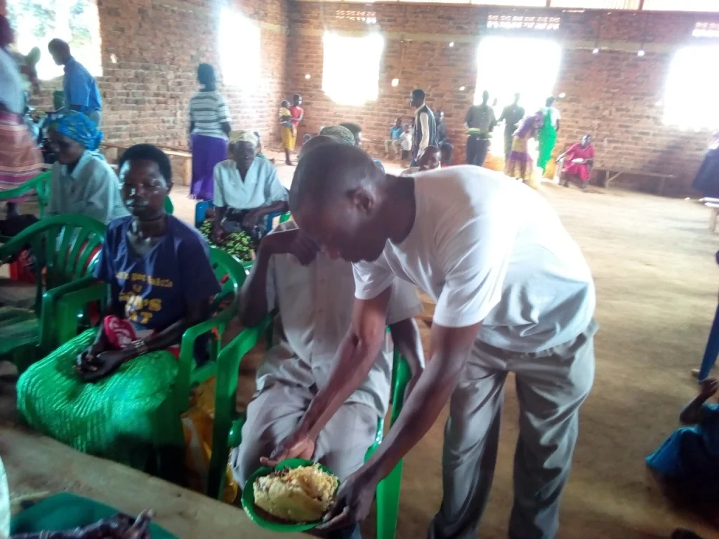 Bp Bita leads the village pastors team to serve food at the conference.1.jpg