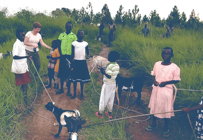2013 Children receiving goats to take home to their family