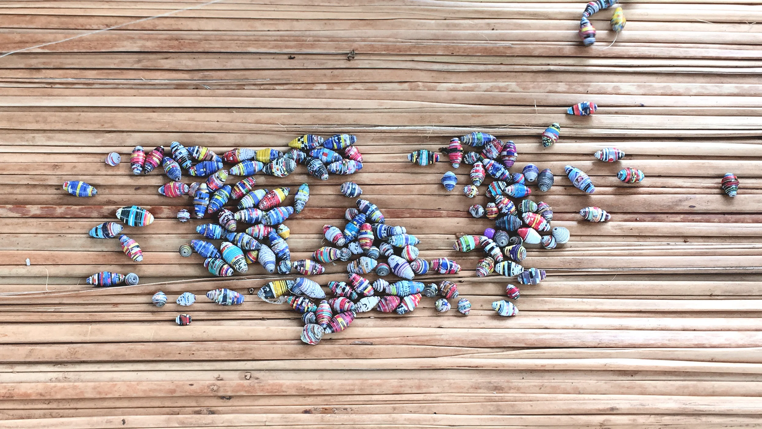 Paper beads before being strung